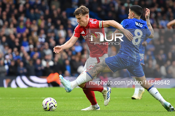 Ryan Yates of Nottingham Forest is under pressure from Enzo Fernandez of Chelsea during the Premier League match between Chelsea and Notting...