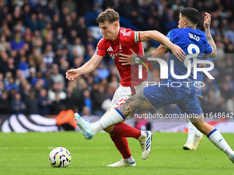 Ryan Yates of Nottingham Forest is under pressure from Enzo Fernandez of Chelsea during the Premier League match between Chelsea and Notting...