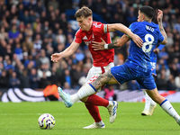 Ryan Yates of Nottingham Forest is under pressure from Enzo Fernandez of Chelsea during the Premier League match between Chelsea and Notting...