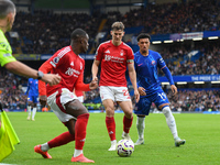 Ryan Yates of Nottingham Forest and Callum Hudson-Odoi of Nottingham Forest are under pressure from Jadon Sancho of Chelsea during the Premi...