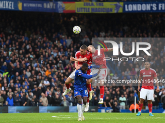 Nikola Milenkovic of Nottingham Forest and James Ward-Prowse of Nottingham Forest battle with Nicolas Jackson of Chelsea during the Premier...