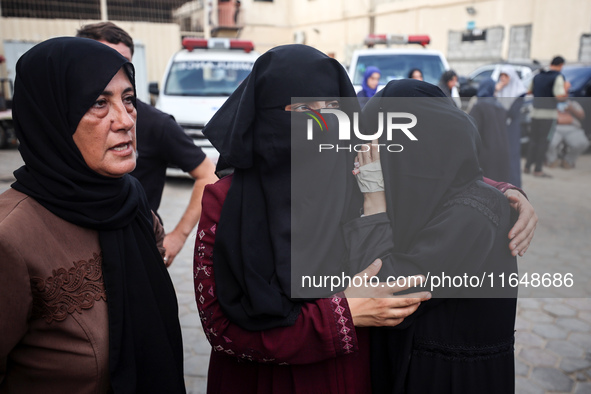 Palestinians mourn their relatives who are killed in overnight Israeli airstrikes on the Al-Bureij refugee camp in central Gaza at the Al-Aq...