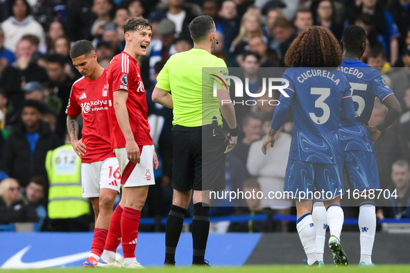 Ryan Yates of Nottingham Forest comments to Referee Chris Kavanagh during the Premier League match between Chelsea and Nottingham Forest at...