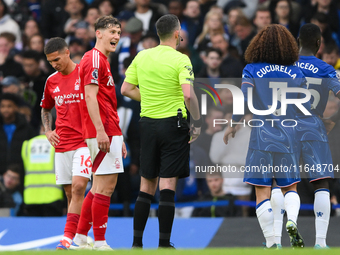 Ryan Yates of Nottingham Forest comments to Referee Chris Kavanagh during the Premier League match between Chelsea and Nottingham Forest at...