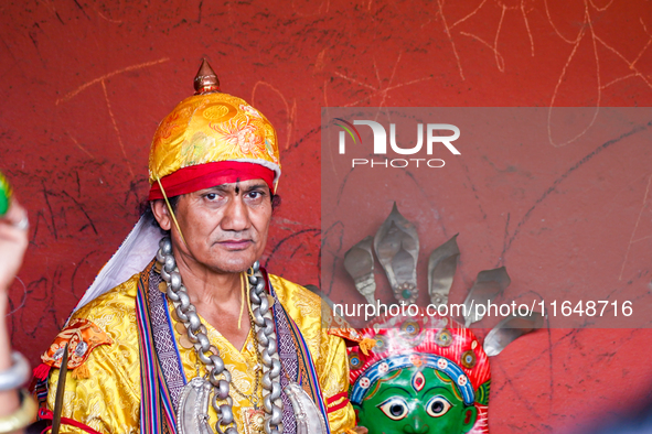 A Nepalese Hindu devotee impersonates a deity, wearing traditional deity clothes and ornaments for the celebration of the Shikali Jatra Fest...