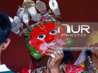 A Nepalese Hindu devotee impersonates a deity, wearing traditional deity clothes and ornaments for the celebration of the Shikali Jatra Fest...