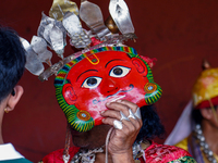 A Nepalese Hindu devotee impersonates a deity, wearing traditional deity clothes and ornaments for the celebration of the Shikali Jatra Fest...