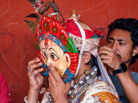 A Nepalese Hindu devotee impersonates a deity, wearing traditional deity clothes and ornaments for the celebration of the Shikali Jatra Fest...