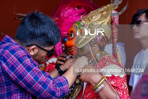 A Nepalese Hindu devotee impersonates a deity, wearing traditional deity clothes and ornaments for the celebration of the Shikali Jatra Fest...