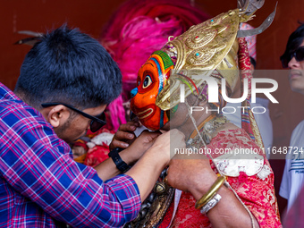 A Nepalese Hindu devotee impersonates a deity, wearing traditional deity clothes and ornaments for the celebration of the Shikali Jatra Fest...