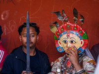 A Nepalese Hindu devotee impersonates a deity, wearing traditional deity clothes and ornaments for the celebration of the Shikali Jatra Fest...