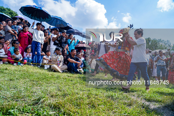 Nepalese Hindu devotees dress as deities and perform a traditional ritual dance during the Sikali Jatra festival in Khokana village, Lalitpu...