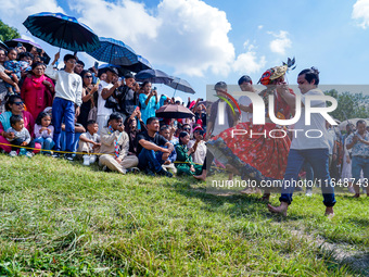 Nepalese Hindu devotees dress as deities and perform a traditional ritual dance during the Sikali Jatra festival in Khokana village, Lalitpu...