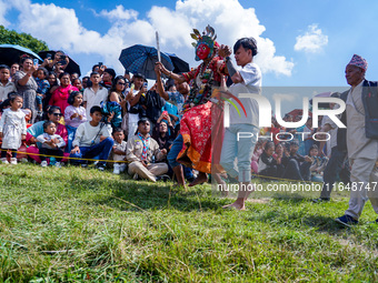 Nepalese Hindu devotees dress as deities and perform a traditional ritual dance during the Sikali Jatra festival in Khokana village, Lalitpu...