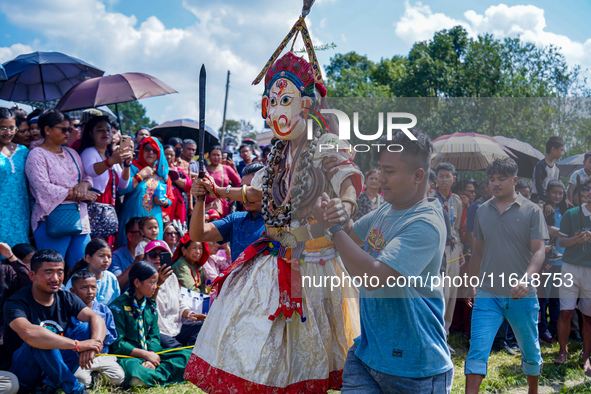 Nepalese Hindu devotees dress as deities and perform a traditional ritual dance during the Sikali Jatra festival in Khokana village, Lalitpu...