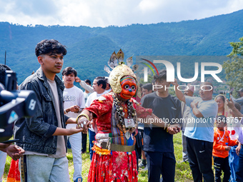 Nepalese Hindu devotees dress as deities and perform a traditional ritual dance during the Sikali Jatra festival in Khokana village, Lalitpu...