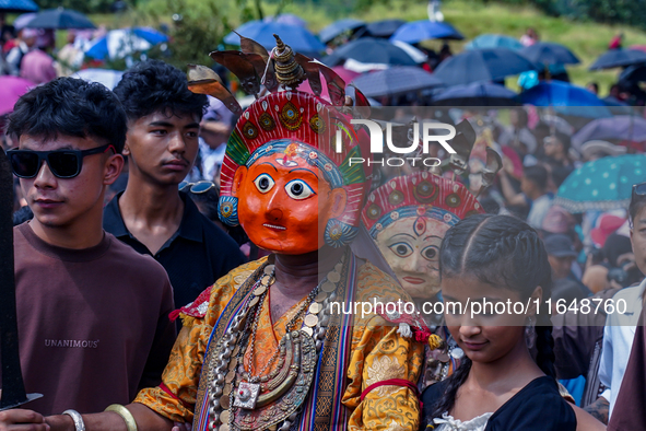 Nepalese Hindu devotees dress as deities and perform a traditional ritual dance during the Sikali Jatra festival in Khokana village, Lalitpu...