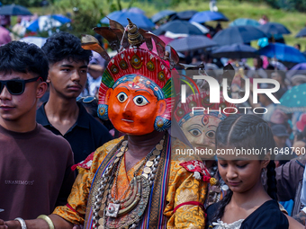 Nepalese Hindu devotees dress as deities and perform a traditional ritual dance during the Sikali Jatra festival in Khokana village, Lalitpu...