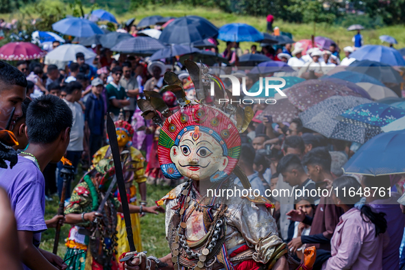 Nepalese Hindu devotees dress as deities and perform a traditional ritual dance during the Sikali Jatra festival in Khokana village, Lalitpu...