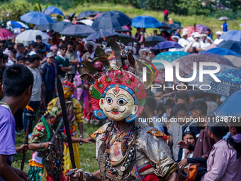 Nepalese Hindu devotees dress as deities and perform a traditional ritual dance during the Sikali Jatra festival in Khokana village, Lalitpu...