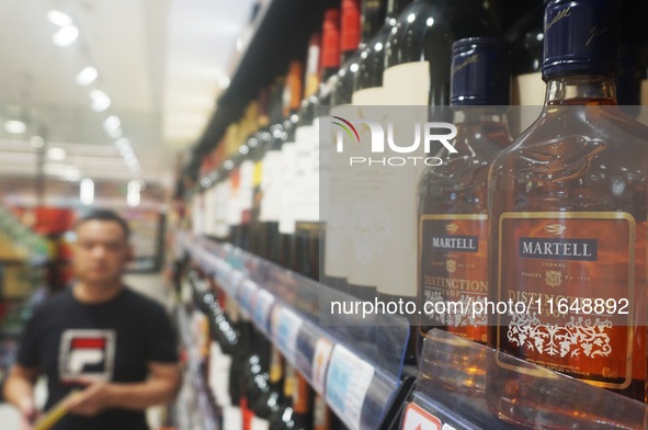 A photo taken on October 8, 2024, shows Martell cognac from France at a supermarket in Hangzhou, China. On the same day, the Ministry of Com...