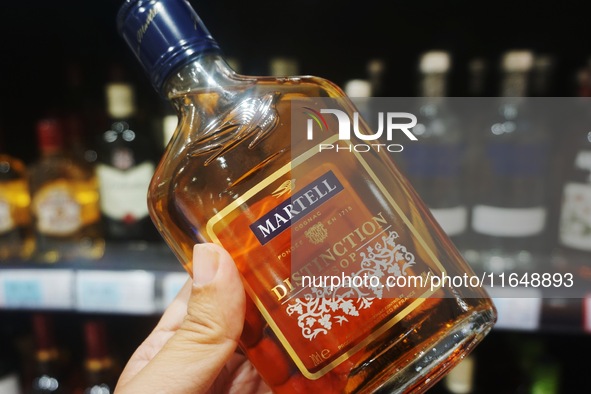 A photo taken on October 8, 2024, shows Martell cognac from France at a supermarket in Hangzhou, China. On the same day, the Ministry of Com...