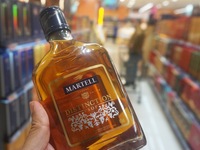 A photo taken on October 8, 2024, shows Martell cognac from France at a supermarket in Hangzhou, China. On the same day, the Ministry of Com...