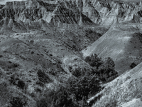 Badlands National Park in South Dakota, USA, contains 242,756 acres of sharply eroded buttes and pinnacles, along with the largest undisturb...