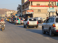 Palestinians in northern Syria commemorate October 7, 2024, by waving Palestinian flags and driving through the streets in their cars. (