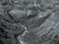 Badlands National Park in South Dakota, USA, contains 242,756 acres of sharply eroded buttes and pinnacles, along with the largest undisturb...