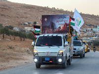 Palestinians in northern Syria commemorate October 7, 2024, by waving Palestinian flags and driving through the streets in their cars. (