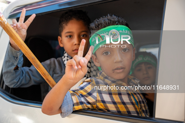 Palestinians in northern Syria commemorate October 7, 2024, by waving Palestinian flags and driving through the streets in their cars. 