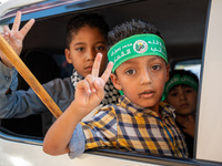 Palestinians in northern Syria commemorate October 7, 2024, by waving Palestinian flags and driving through the streets in their cars. (