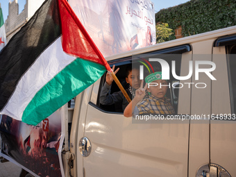 Palestinians in northern Syria commemorate October 7, 2024, by waving Palestinian flags and driving through the streets in their cars. (