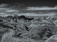 Badlands National Park in South Dakota, USA, contains 242,756 acres of sharply eroded buttes and pinnacles, along with the largest undisturb...