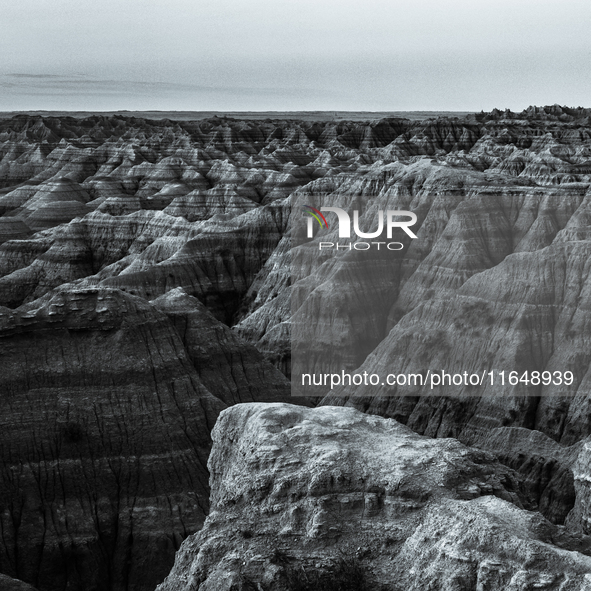 Badlands National Park in South Dakota, USA, contains 242,756 acres of sharply eroded buttes and pinnacles, along with the largest undisturb...