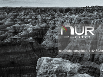 Badlands National Park in South Dakota, USA, contains 242,756 acres of sharply eroded buttes and pinnacles, along with the largest undisturb...