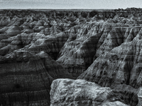 Badlands National Park in South Dakota, USA, contains 242,756 acres of sharply eroded buttes and pinnacles, along with the largest undisturb...