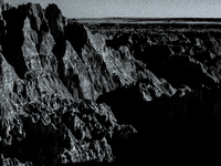 Badlands National Park in South Dakota, USA, contains 242,756 acres of sharply eroded buttes and pinnacles, along with the largest undisturb...