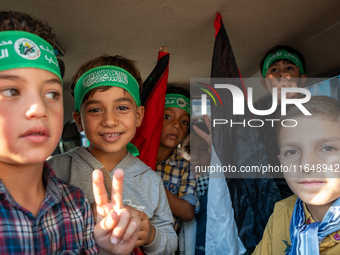 Palestinians in northern Syria commemorate October 7, 2024, by waving Palestinian flags and driving through the streets in their cars. (