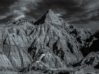 Badlands National Park in South Dakota, USA, contains 242,756 acres of sharply eroded buttes and pinnacles, along with the largest undisturb...