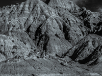 Badlands National Park in South Dakota, USA, contains 242,756 acres of sharply eroded buttes and pinnacles, along with the largest undisturb...