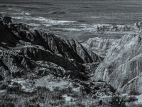 Badlands National Park in South Dakota, USA, contains 242,756 acres of sharply eroded buttes and pinnacles, along with the largest undisturb...