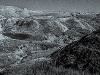 Badlands National Park in South Dakota, USA, contains 242,756 acres of sharply eroded buttes and pinnacles, along with the largest undisturb...