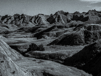 Badlands National Park in South Dakota, USA, contains 242,756 acres of sharply eroded buttes and pinnacles, along with the largest undisturb...