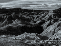 Badlands National Park in South Dakota, USA, contains 242,756 acres of sharply eroded buttes and pinnacles, along with the largest undisturb...