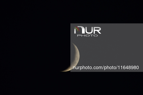 A rising Crescent Moon is seen from Kirtipur, Kathmandu, Nepal, on October 7, 2024. 