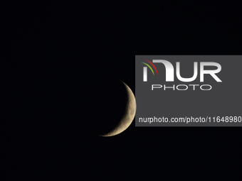 A rising Crescent Moon is seen from Kirtipur, Kathmandu, Nepal, on October 7, 2024. (