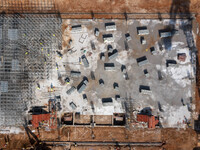 Workers work at the construction site of the second phase of the Foshan -- East and West Guizhou Cooperative Industrial Park in Congjiang Co...