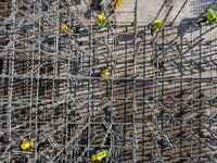 Workers work at the construction site of the second phase of the Foshan -- East and West Guizhou Cooperative Industrial Park in Congjiang Co...